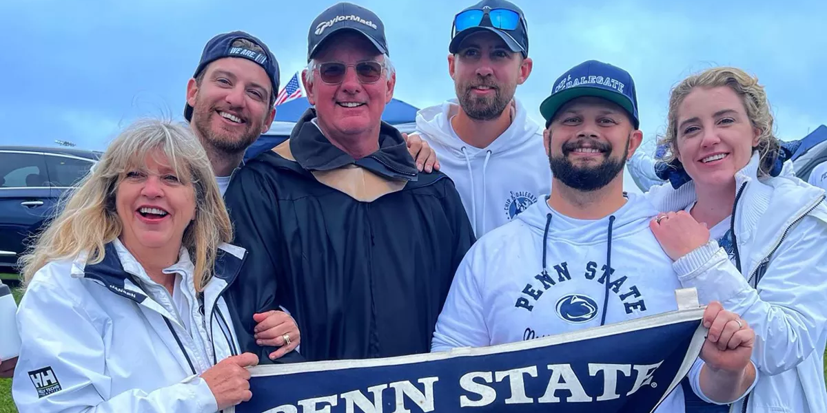 Dale Quayle and family with Penn State banner