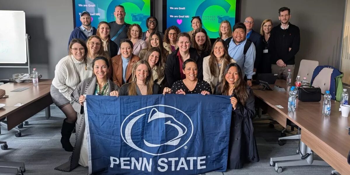 Students in Hungarian classroom with Penn State flag